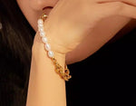 Stylish gold bracelet with pearls